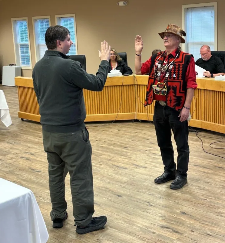 Election Board Chairman Michael Brainard swearing in Chief Barrett